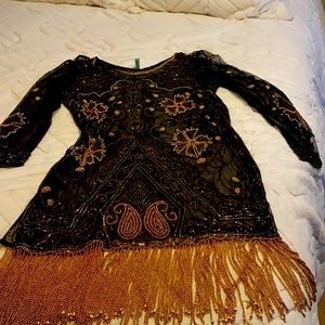 This is more like a throw over your other clothing.